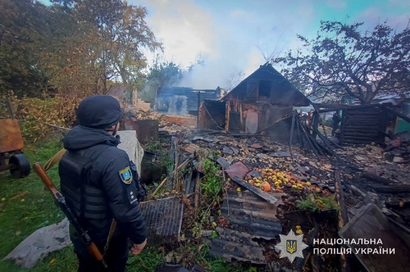 Rescuers work at the site of a shelling in the Sumy region