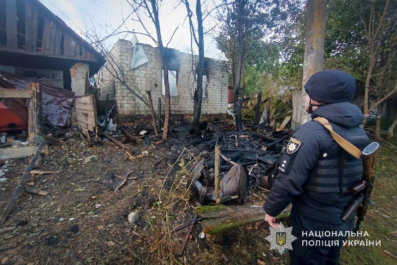 Rescuers work at the site of a shelling in the Sumy region
