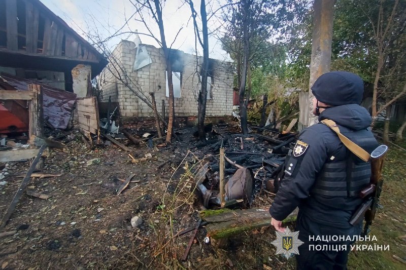 Rescuers work at the site of a shelling in the Sumy region