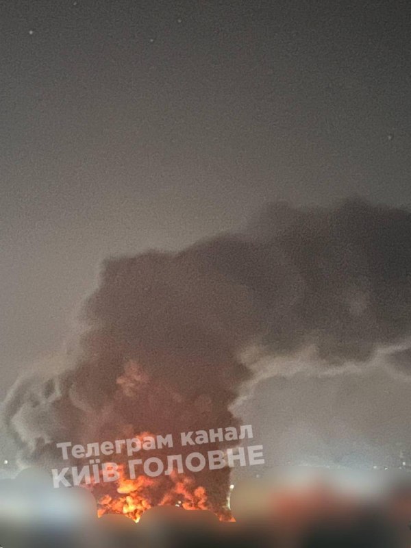 Firefighters extinguish a fire in Kyiv after a nighttime attack