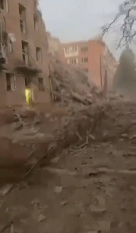Rescuers work at the site of a missile strike on a residential building in Pryluky