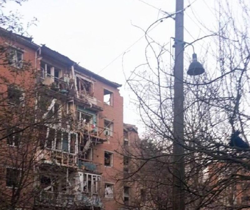 Rescuers work at the site of a missile strike on a residential building in Pryluky