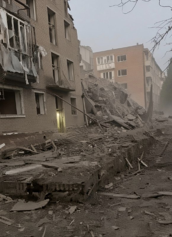 Rescuers work at the site of a missile strike on a residential building in Pryluky