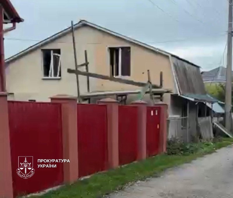 Rescuers work at the site of a strike in Kyiv