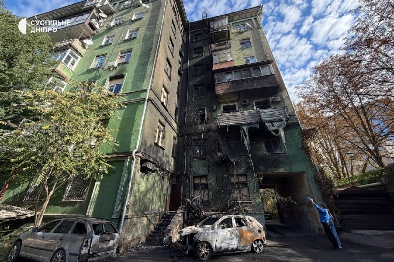 Rescuers and municipal workers operate at the site of a multi-storey building strike in Dnipro
