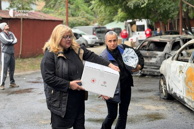 Rescuers and municipal workers operate at the site of a multi-storey building strike in Dnipro
