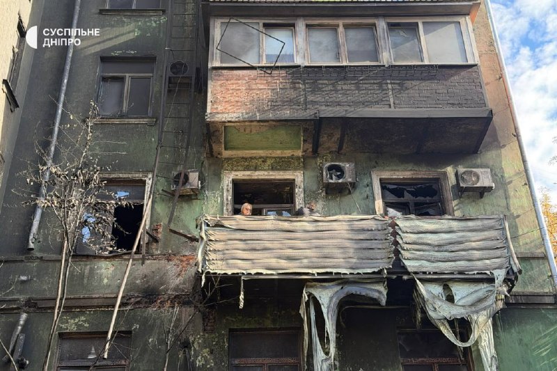 Rescuers and municipal workers operate at the site of a multi-storey building strike in Dnipro