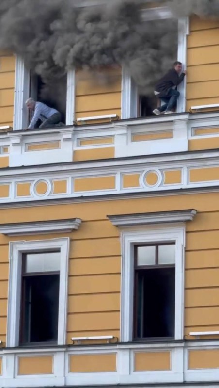 Rescuers work at the site of a drone strike on the National Academy of Sciences of Ukraine building in Kyiv