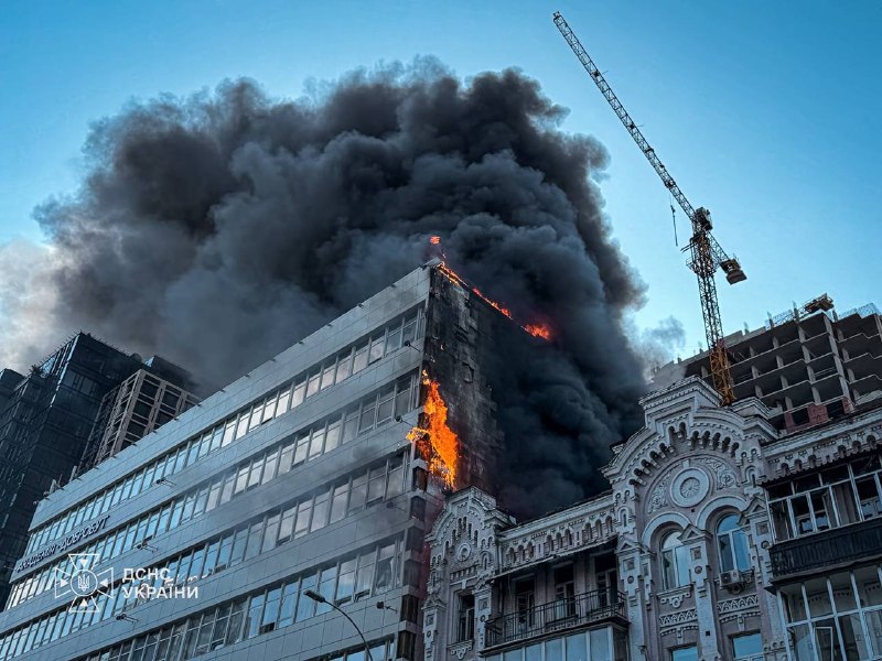 Rescuers work at the site of a drone strike on the National Academy of Sciences of Ukraine building in Kyiv