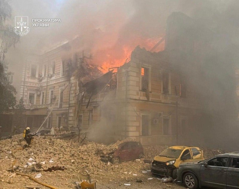 Rescuers work at the site of a drone strike on the National Academy of Sciences of Ukraine building in Kyiv