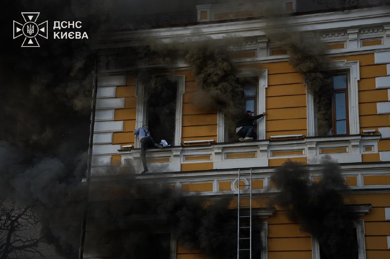 Rescuers work at the site of a drone strike on the National Academy of Sciences of Ukraine building in Kyiv