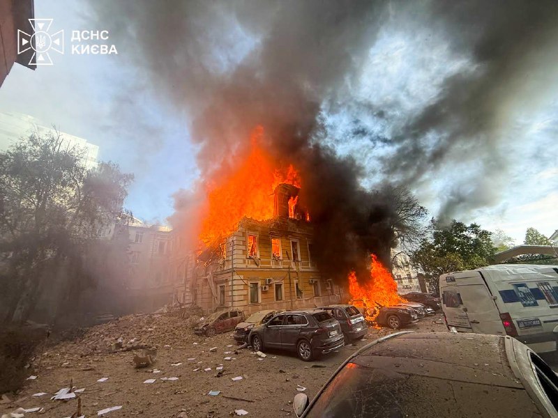 Rescuers work at the site of a drone strike on the National Academy of Sciences of Ukraine building in Kyiv
