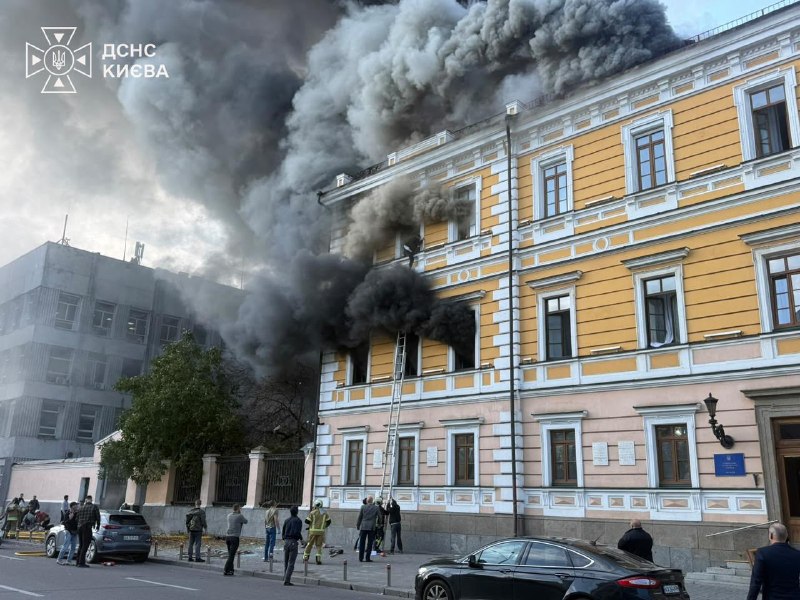 Rescuers work at the site of a drone strike on the National Academy of Sciences of Ukraine building in Kyiv