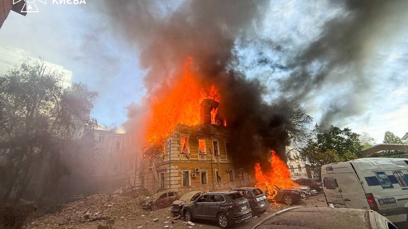 Rescuers work at the site of a drone strike on the National Academy of Sciences of Ukraine building in Kyiv